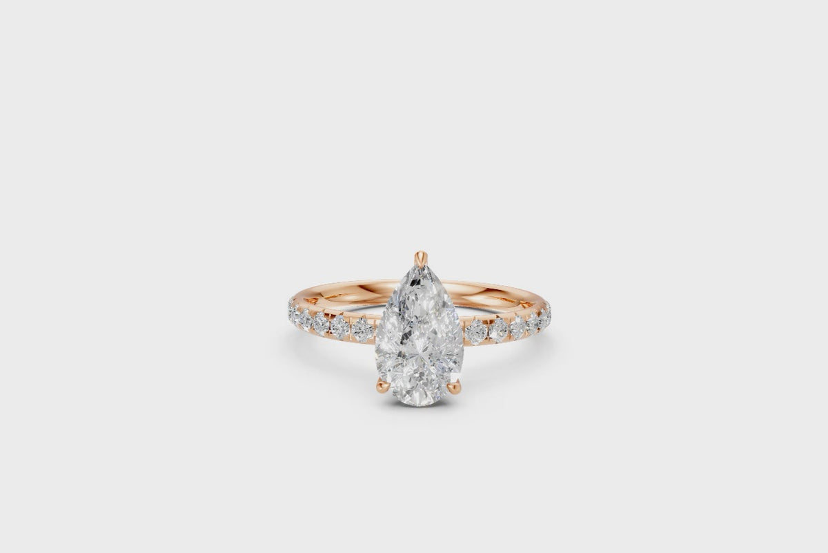 Pear-Cut Diamond Solitaire Ring with Diamond Band