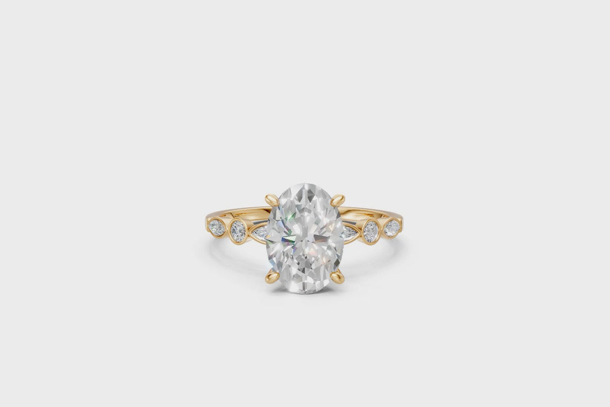 Oval-Cut Ring with Pear & Round Side Stones