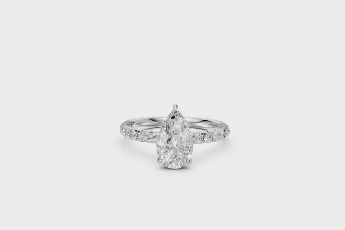 Pear-Cut Diamond Solitaire Ring with Diamond Band