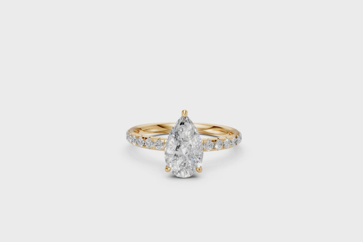 Pear-Cut Diamond Solitaire Ring with Diamond Band