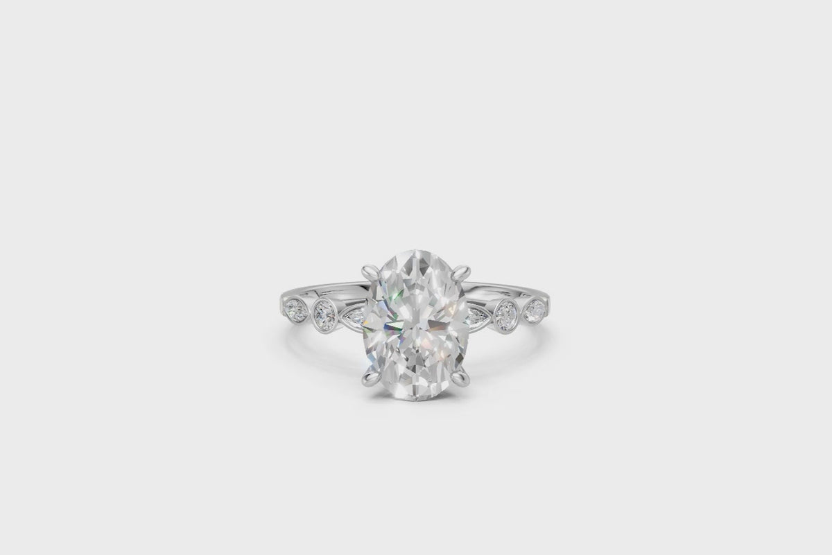 Oval-Cut Ring with Pear & Round Side Stones